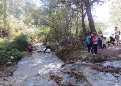 Kids jumping over the river