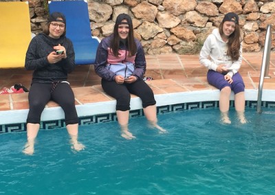 Some of the girls, not brave enough for the pool dip their toes